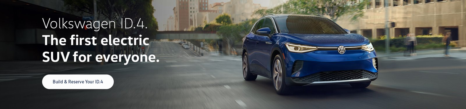An ID.4 in Dusk Blue Metallic drives on an urban road.