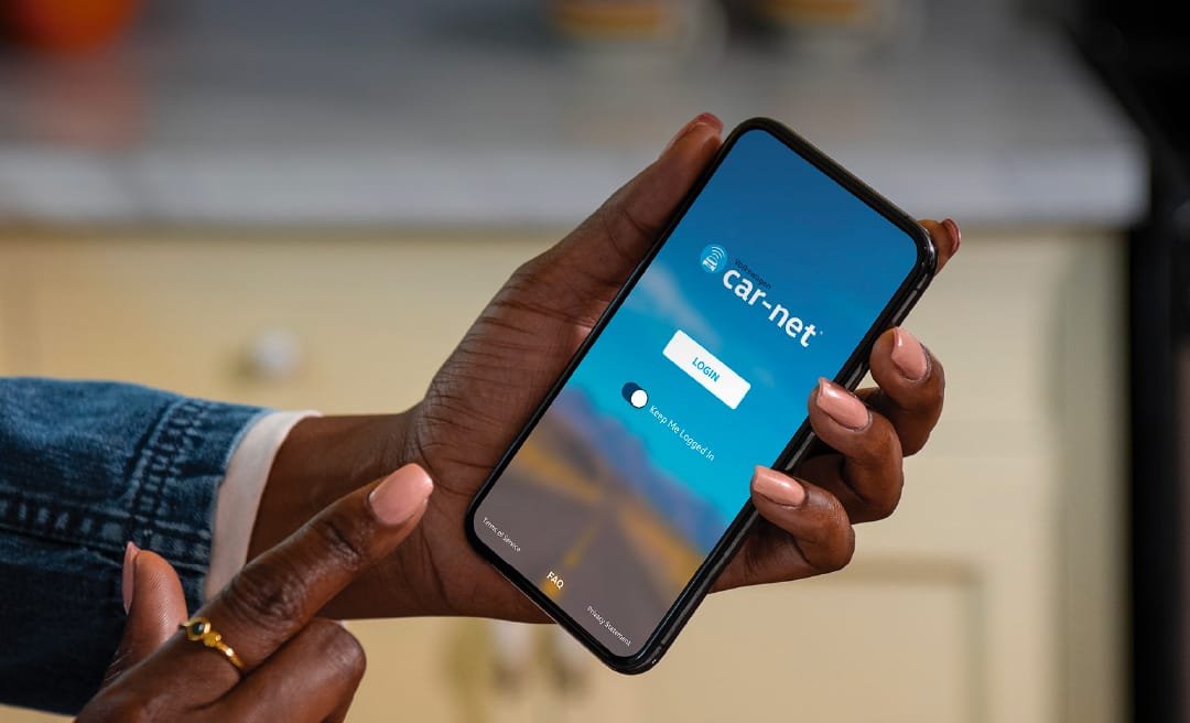 A person holding a smartphone about to tap the screen with their finger