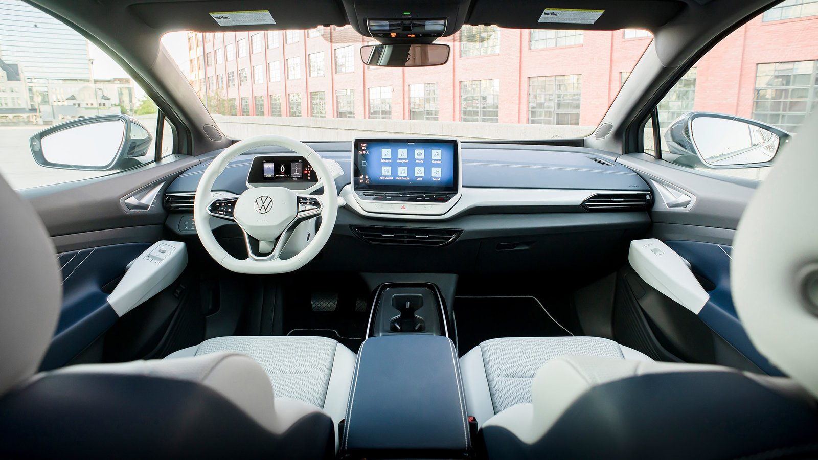 View of front cockpit area of an ID.4 shown in Cosmic interior world as seen from the back seat.