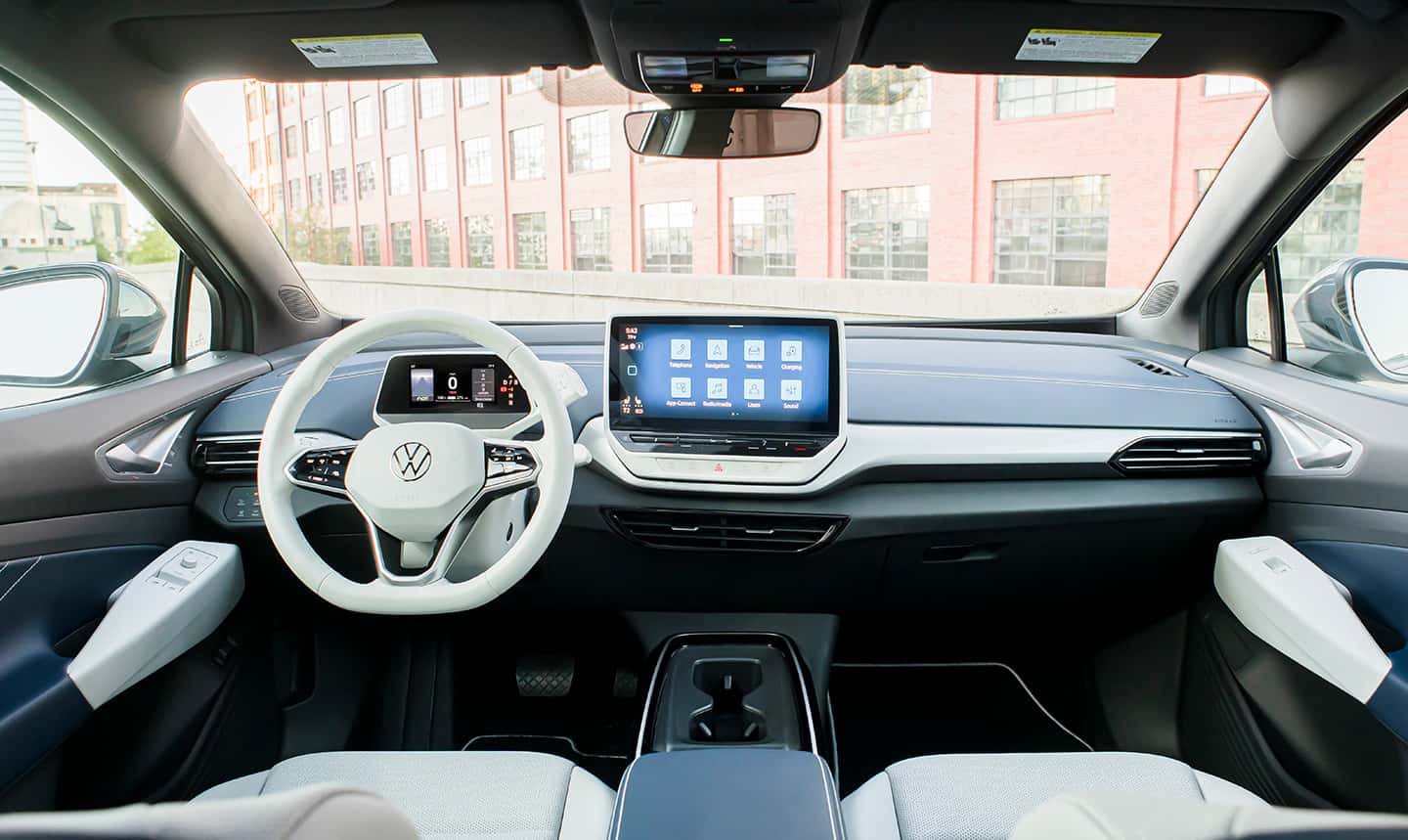 View of front cockpit area of an ID.4 shown in Cosmic interior as seen from the back seat.