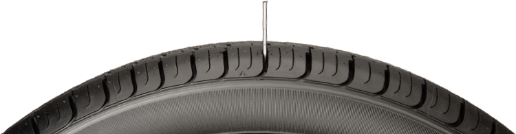 Tire with a nail in the tread
