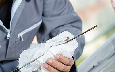 how do i check the engine oil in my car?